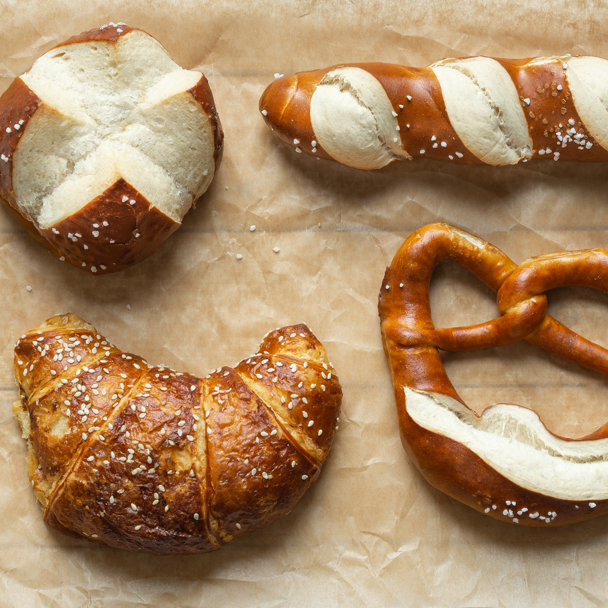 Herstellung von Laugengebäck mit Bäckereimaschinen Herstellung von Laugengebäck mit Bäckereimaschinen